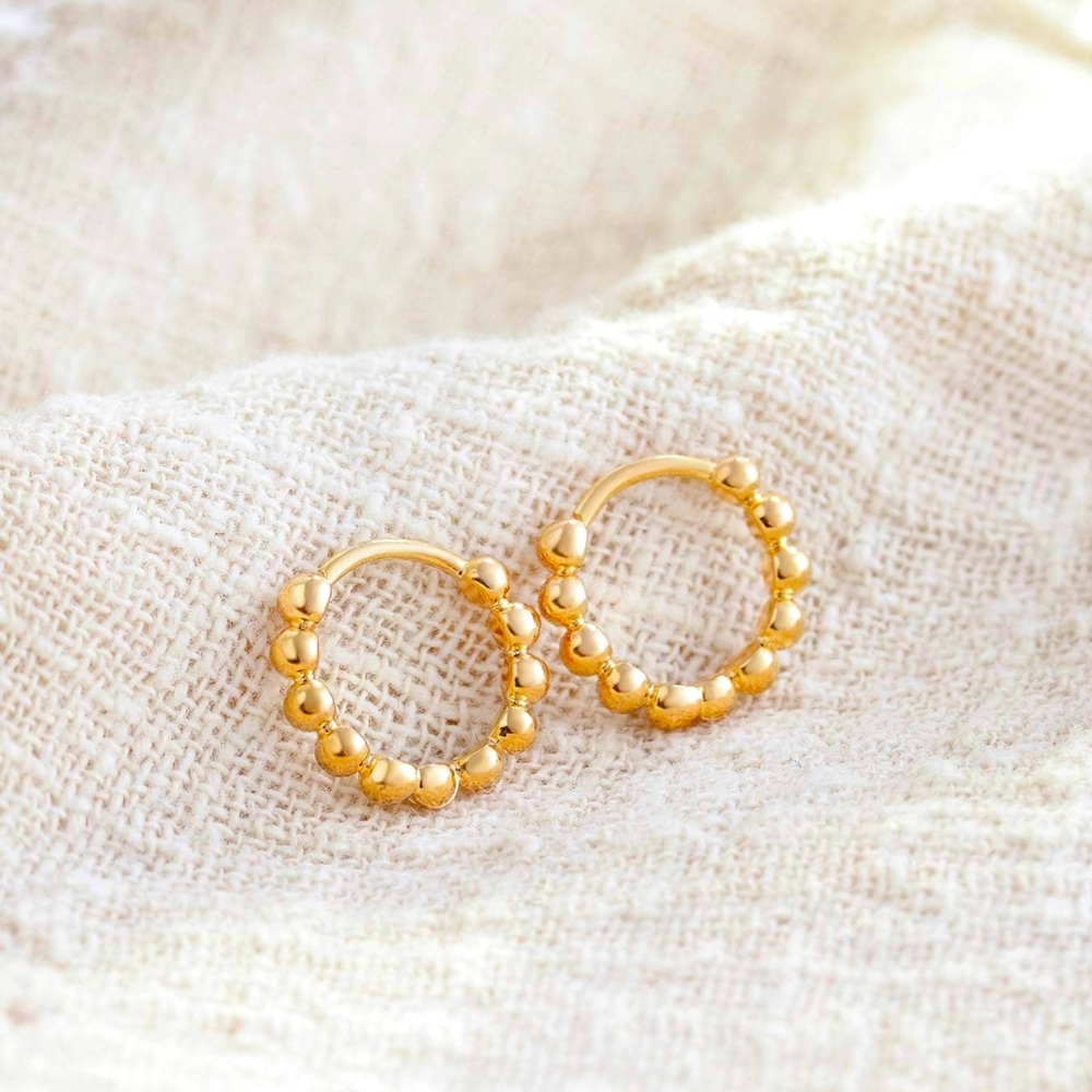 RESTOCKED!! ✨ New 18k gold plated scalloped 8mm huggies.